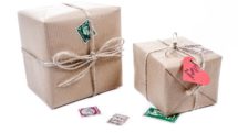 Gifts in brown paper boxes with string ribbons.