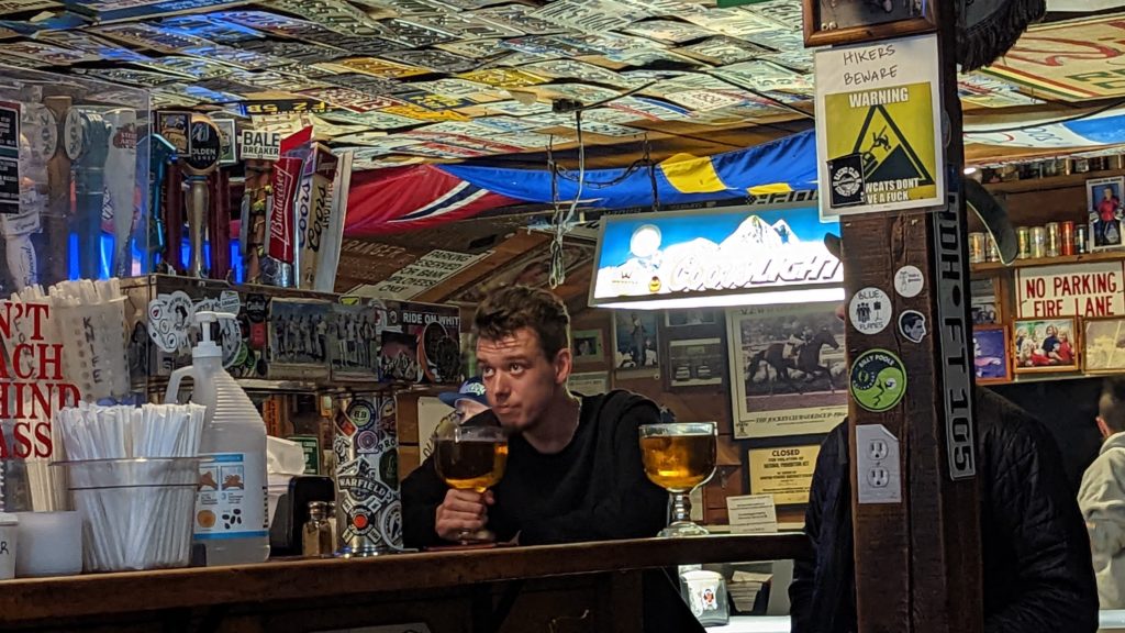 License plates decorate the classic Grumpy's bar in Ketchum, where diners can have a huge schooner of draft beer with delicious hamburgers.