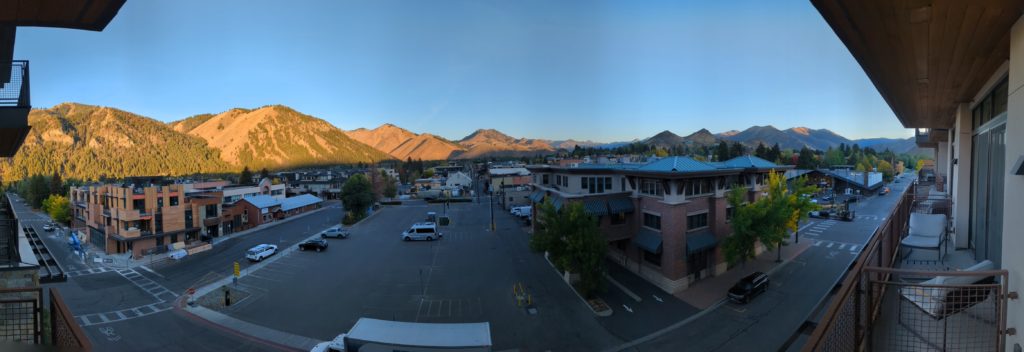 Panoramic view of the Sawtooth Mountains from a hotel room balcony at the Limelight Ketchum Hotel in Idaho.