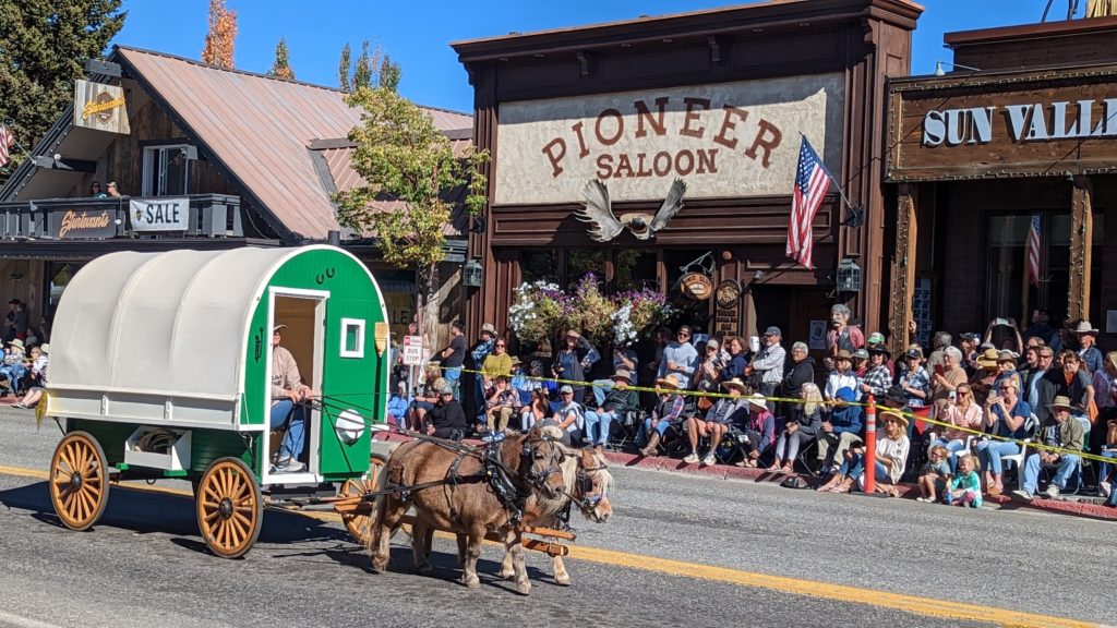 Miniature horses tow a sheepcamp in the Trailing of the Sheep Big Sheep Parade, Ketchum, Idaho