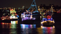 Illuminated boats reflect off the Potomac River during Alexandria Virginia's Holiday Boat Parade of Lights. Photo c. Evan Michio for Visit Alexandria