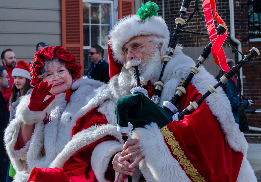 Santa and Mrs. Claus march in the annual Scottish Christmas Walk Parade in Alexandria, Virginia. Photo by R. Kennedy for Visit Alexandria.