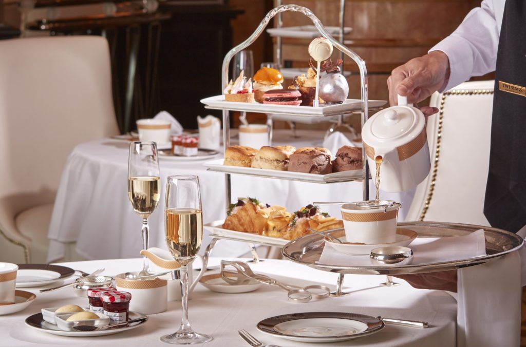 A fancy afternoon tea with champagne in the Verandah restaurant on a Cunard cruise ship.