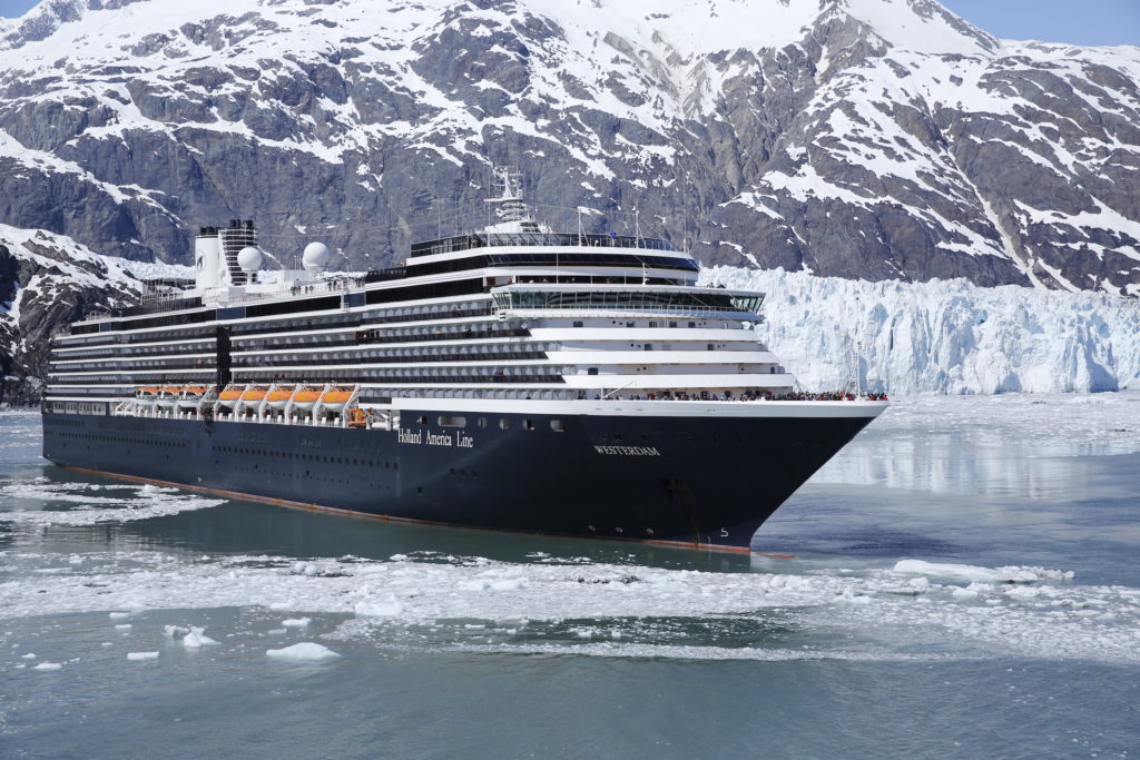 Holland America's Westerdam ship sails past a shelf of glaciers in Glacier Bay, Alaska.