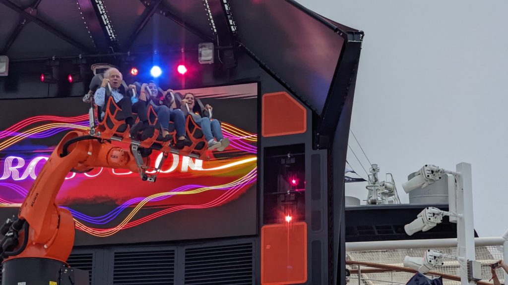 The Robotron mechanical arm swings four passengers on a music-fueled thrill ride on top deck of MSC Seascape.