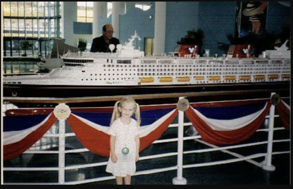 Young girl with cruise ship model.