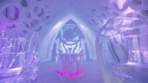 A stunning illuminated bar made out of ice is a centerpiece of the Ice Hotel at Valcariter in Quebec. Photo c. Village Vacances Valcartier