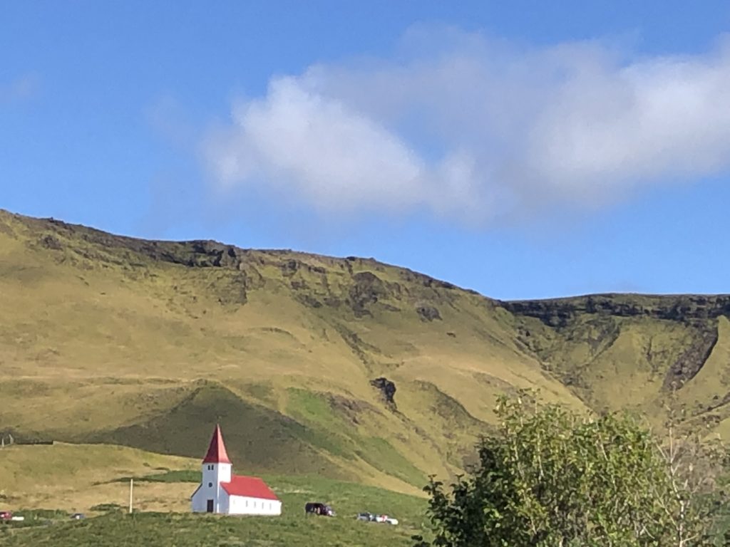 White church with red steeple in the remote Icelandic village of Vik. Photo c. Bethany Kandel