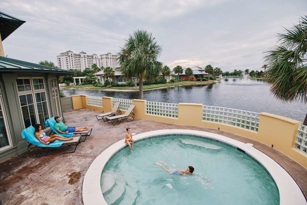 Kids swim in the hot tub of their Lakeside Cottage unit at the Beach Club Gulf Shores, Alabama.