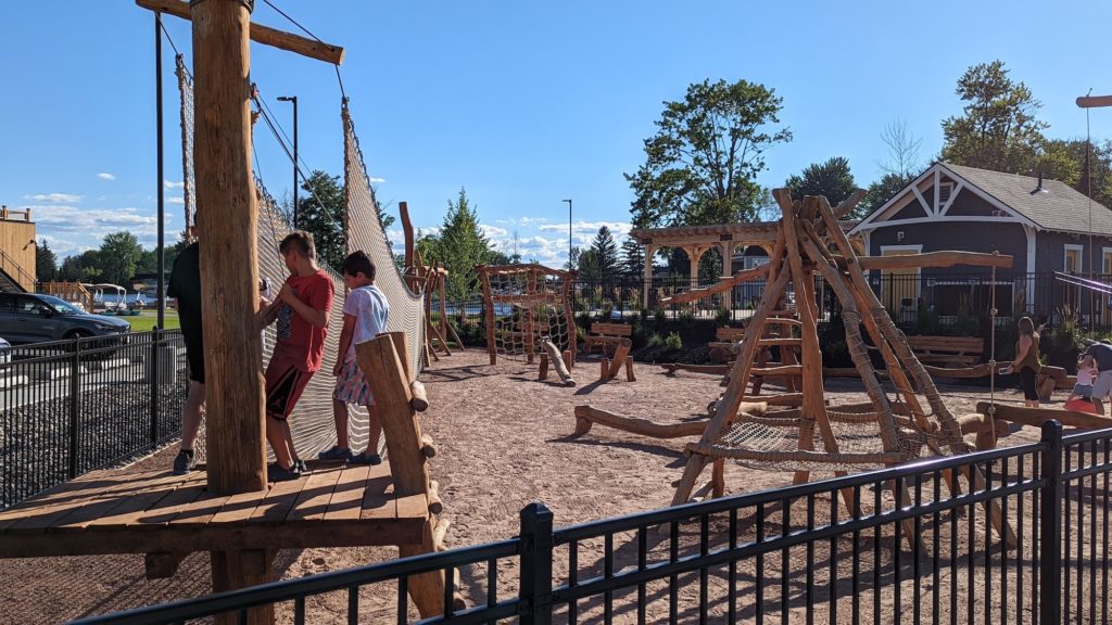 Rustic log playground, rope bridge and climbing course at The Cove at Sylvan Beach resort in Sylvan Beach, New York.