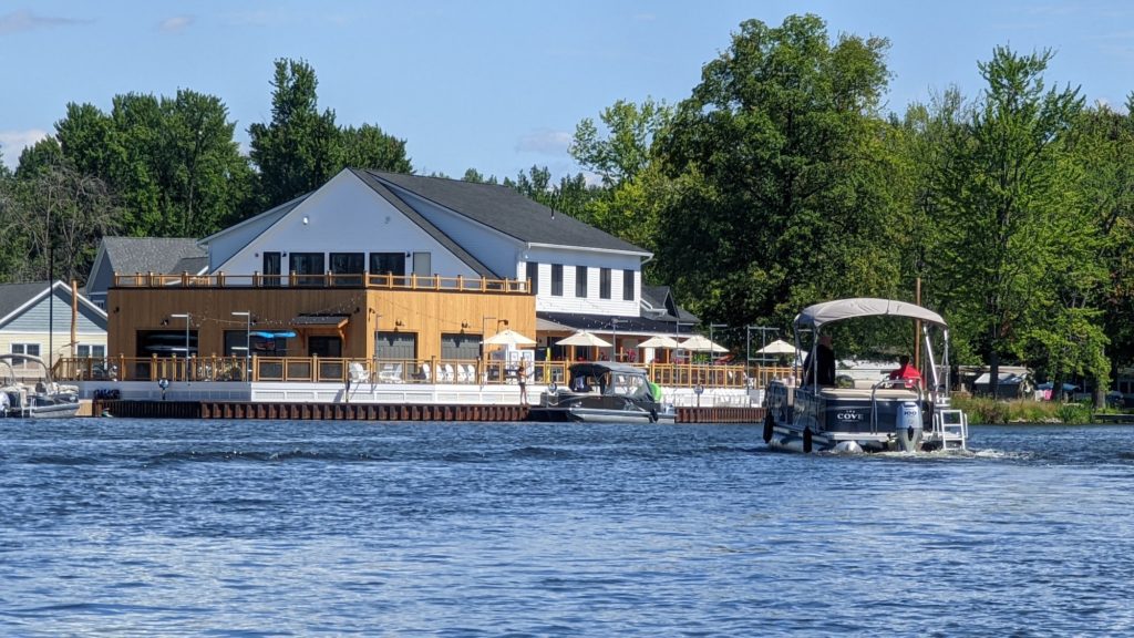 Boats pull up to the Sylvan Beach Supply Company for lunch or a sunset drink on the rooftop bar overlooking Oneida Lake, New York.