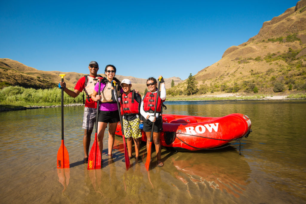 A happy family poses with their inflatable Duckie at a put in near Whitebird in Region II of the Lower Salmon River.