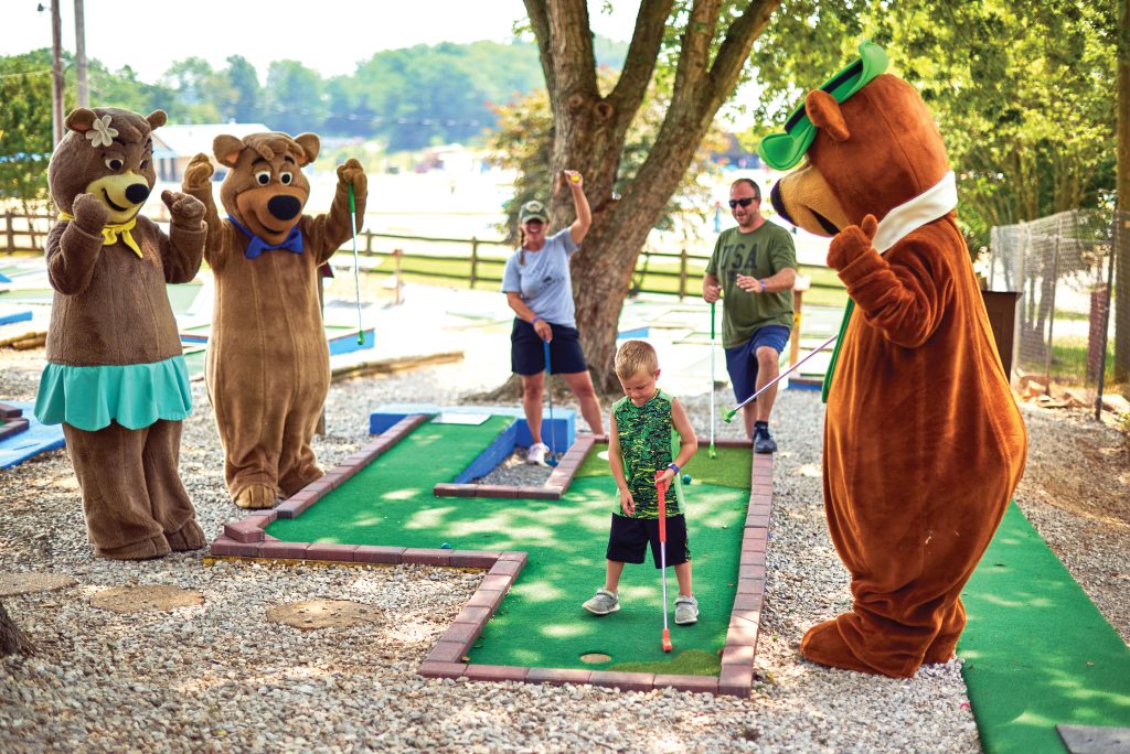 Minigolf is one of many new sports kids can learn while camping. Photo c. Jellystone Park Camp-Resort