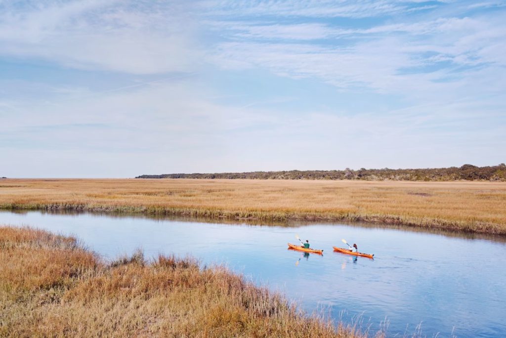 Two kayaks out on the marshes of Amelia Island, Florida.