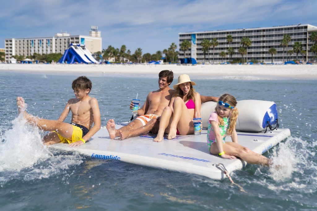 Family enjoys a floating cabana rented at the Tradewinds Island Grand Resort in St. Pete Beach, Florida. Photo c. Tradewinds Resorts