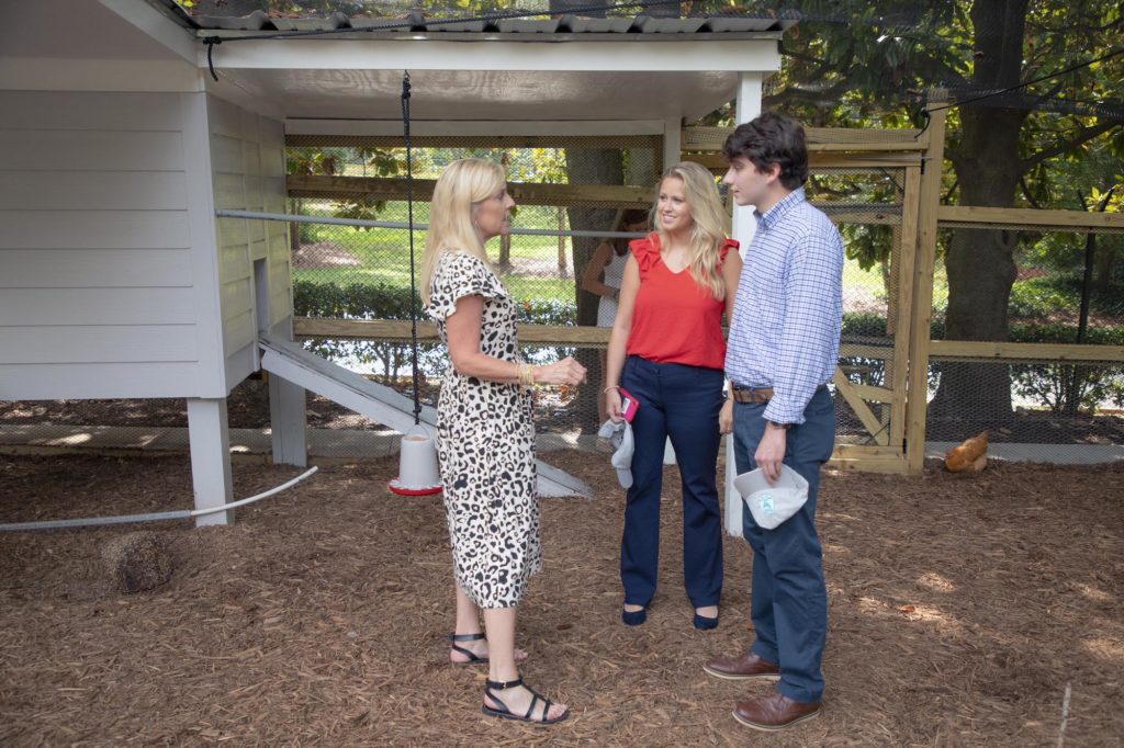 Georgia's First Lady Marty Kemp talks with visitors about First Flock, the innovative chicken coop at the Governor's Mansion.