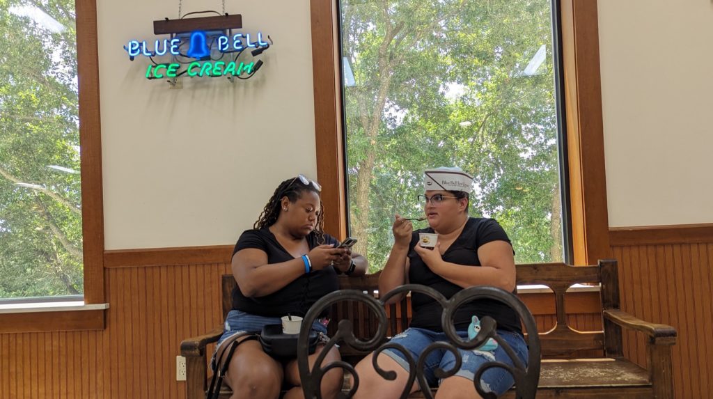 Friends sample and photograph their favorite flavors with $1 scoops from the Blue Bell Creamery ice Cream Parlor in Brenham, Texas.