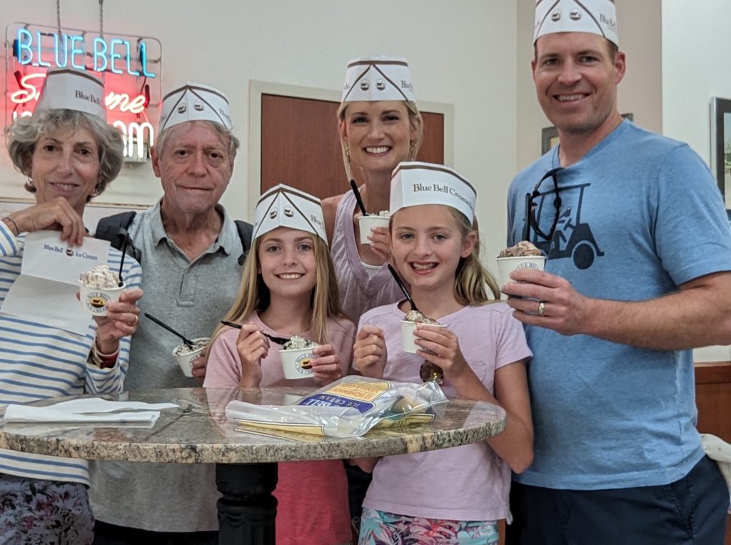 Author and family sampling eveyone's favorite Blue Bell flavor at the ice cream parlor next to the Blue Bell factory tour.