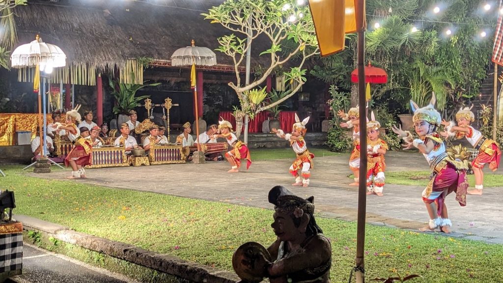 Young dancers perform a traditional Legong dance at a Balinese Cultural Evening with a feast at Lake Leke in Ubud.