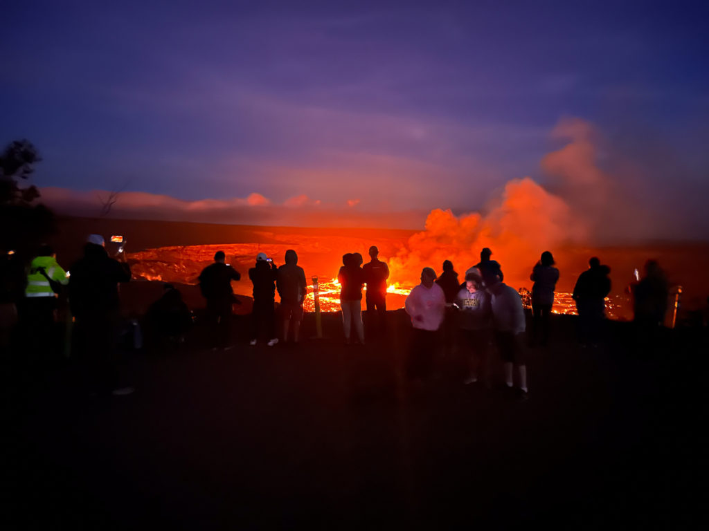 Tourists watch eruption of Kilauea in September 2023 from the crater rim at Volcanoes National Park in Hawaii. Photo c. NPS