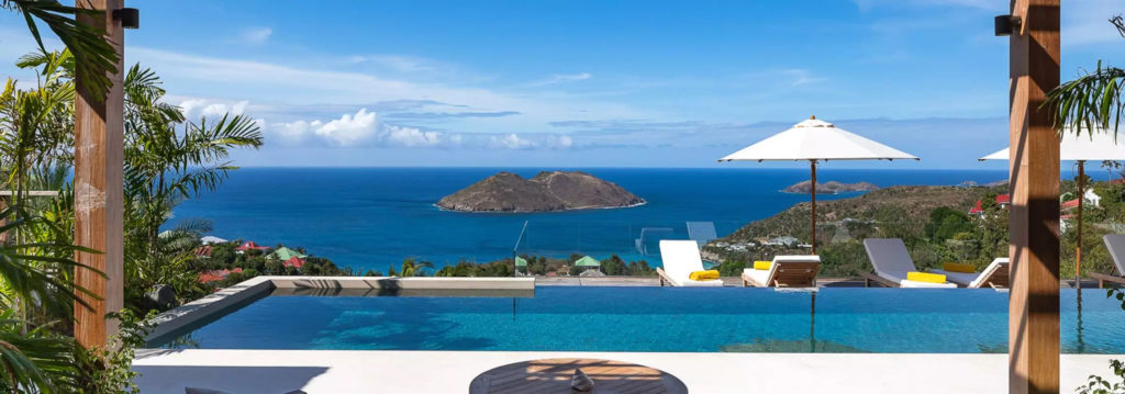 An infinity pool with views of the Caribbean from a hilltop on the island of St. Barts.