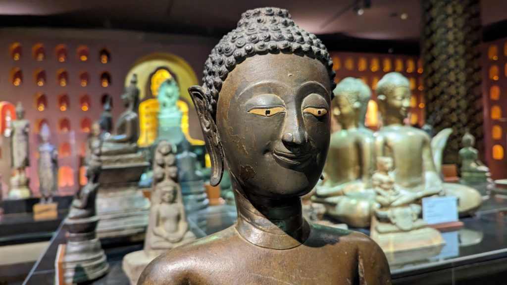 Smiling bronze Buddha statue from the collection at Angkor National Museum in Siem Reap. Photo by Ron Bozman/Spring Hill Productions