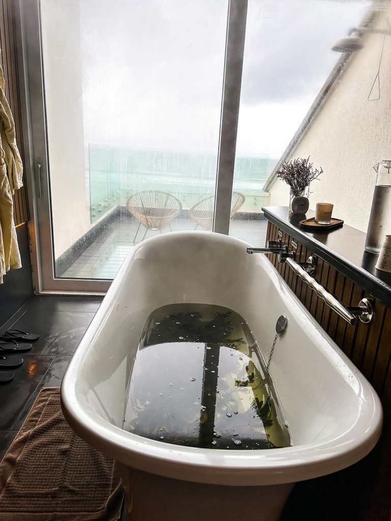 Enjoy a soak in a Voya Seaweed bath tub with gorgeus views outside in Ireland with family