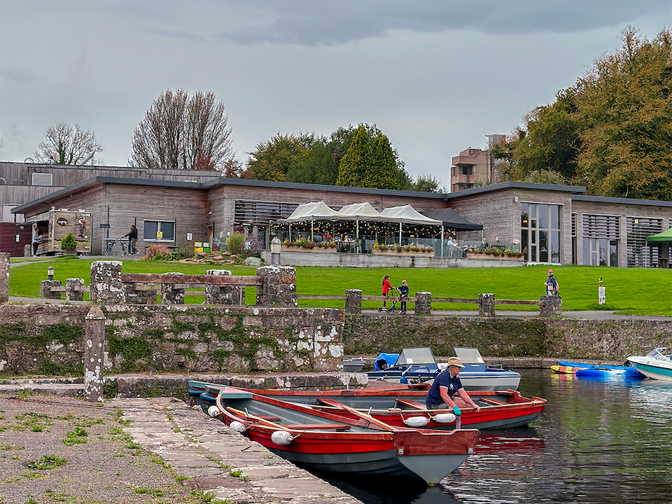 Rowboats docked on Lough Key Lake outside the adventure center in Ireland.