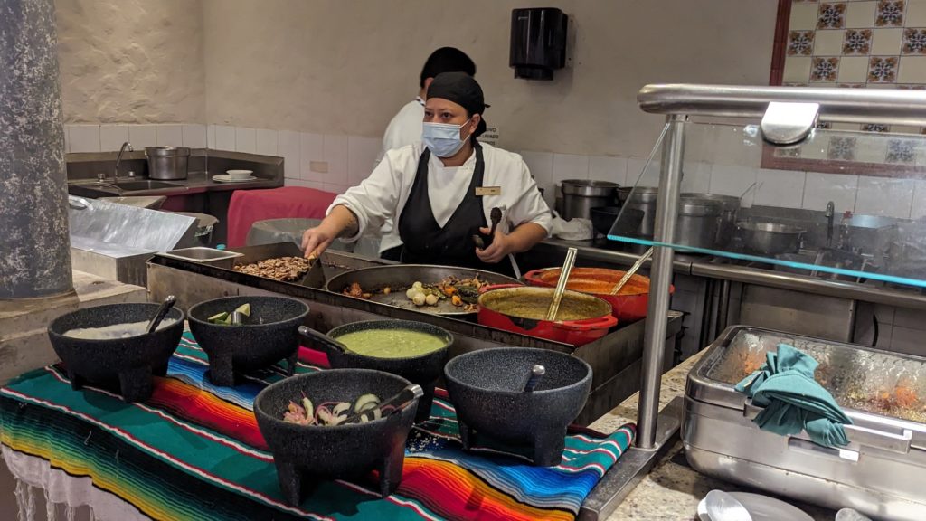 Busy Mexican breakfast buffet station serving fresh quesadillas during our timeshare sales presentation at this interval ownership resort in Los Cabos.
