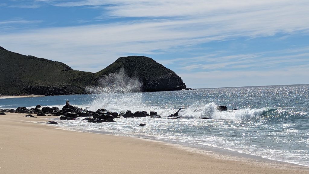The quiet beach at Todos Santos contrasts with the turbulent surf of the Sea of Cortez.