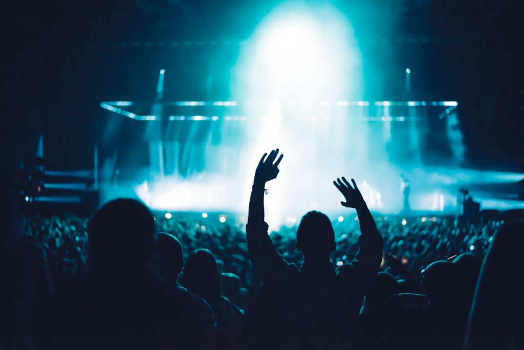 Crowd in silhouette at a nighttime concert. Photo c. Sebastian Ervi for pexels.