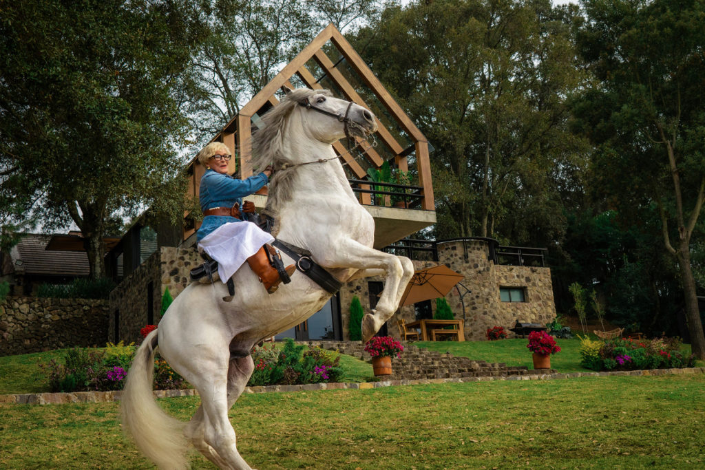 Glenn Close on horseback at a Texas Ranch for the Booking.com Super Bowl ad.