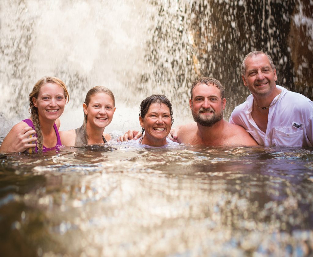 Family swims in Sinumo Creek in the Upper Grand Canyon. Photo c. Western River Expeditions