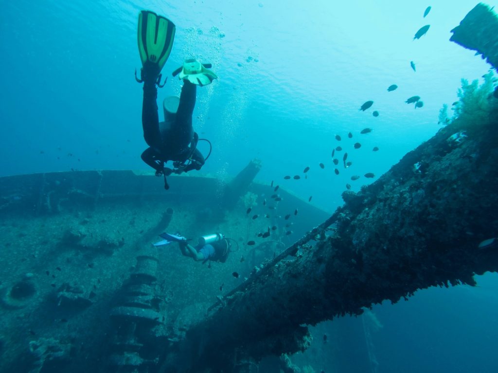 Two divers seeking adventure in Jordan explore a shipwreck off the coast of Aqaba. Photo c. unsplash