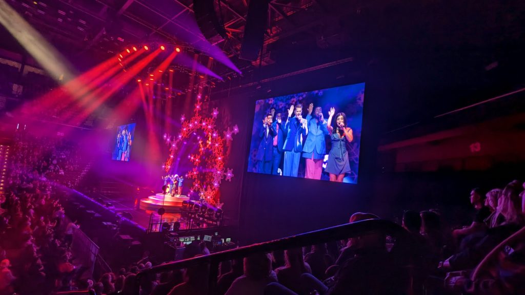 Audience cheers for Pentatonix, seen live and on big video screens, at the Mohegan Sun Arena in Uncasville, Connecticut.