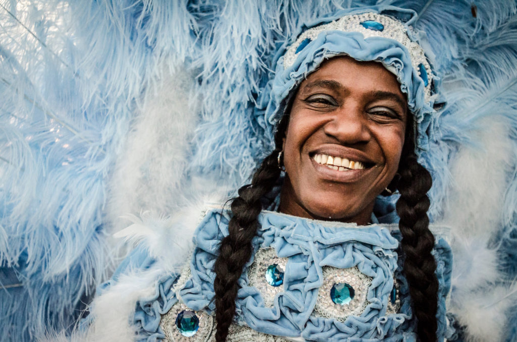 Smiling face of costumed Mardi Gras Indian from a Mardi Gras parade. Photo by Pableaux Johnson/ /NewOrleans.com