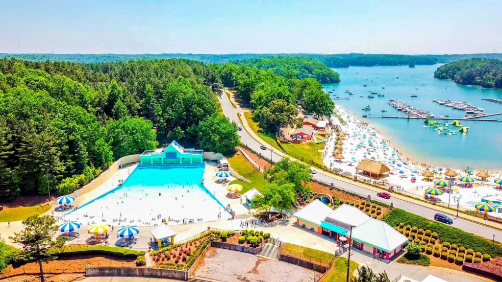 Aerial view of Lake Lanier with the wave pool at the Lake Lanier Resort and busy beach area. Photo c. Lake Lanier Resort