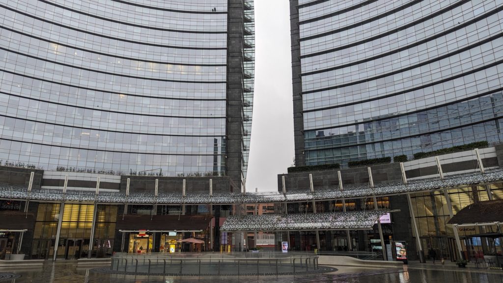 Glass and steel buildings at Piazza Gae Aulenti, one of the more modern neighborhoods in Milan, Italy.