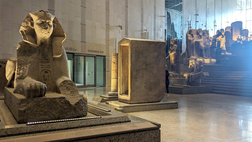 Small Sphinx and Egyptian antiquities themed to Kingship are now on display at the Grand Staircase of the Grand Egyptian Museum. Photo c. Ron Bozman/Spring Hill Prods.