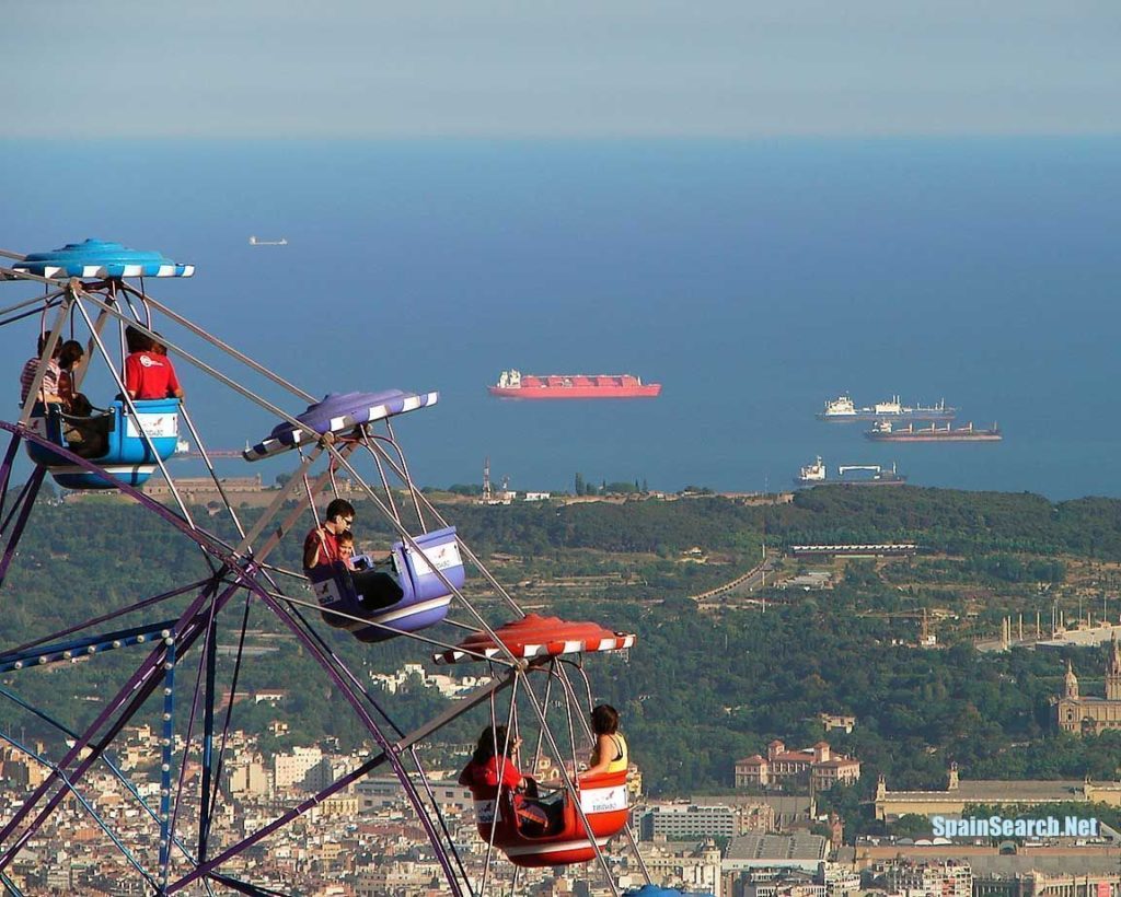 A classic Ferris wheel has views of the port of Barcelona, Spain.