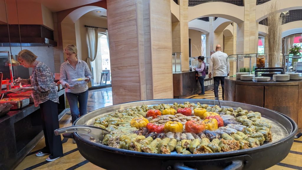 Egyptian buffet at Pavilion 139 includes a dish of grilled cabbage and peppers stuffed with rice and lamb.
