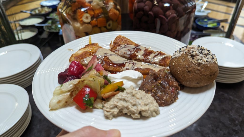 A plate of Egyptian mazza from Pavilion 139 features grilled peppers, eggplant two ways, Labneh yoghurt and feteer (a layered wheat pastry filled with cheese and more) that was once prepared to appease the gods.