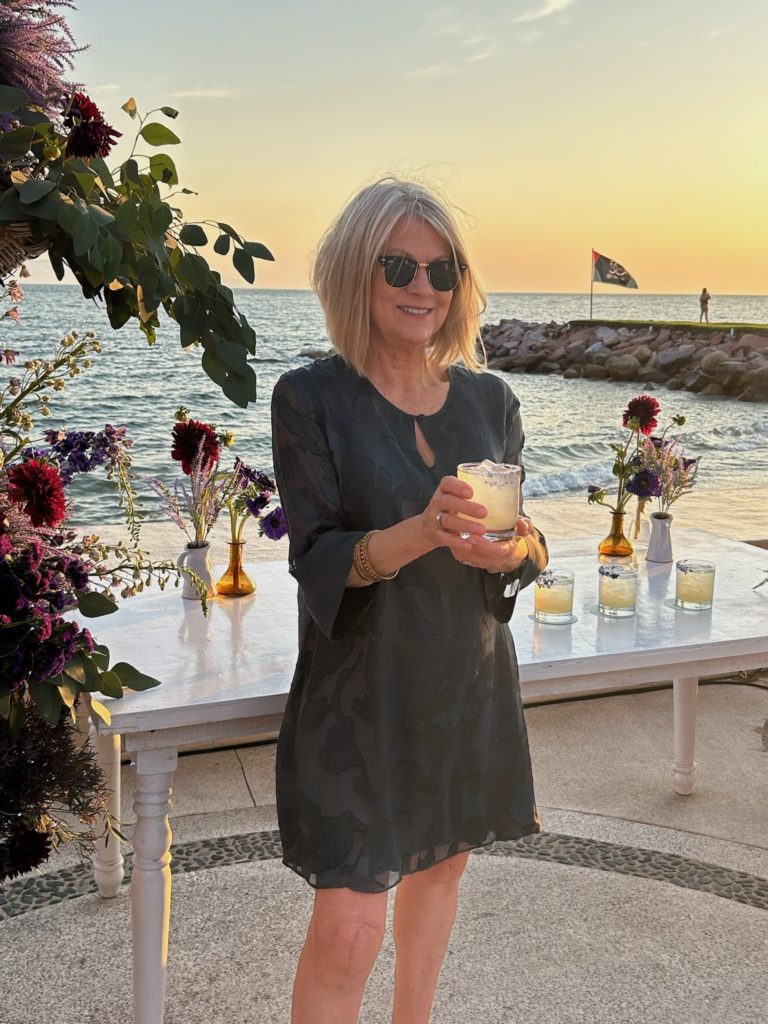 Author enjoys a Lavender Margarita before her family Sunset PIcnic by the beach at the Westin Resort & Spa, Puerto Vallarta.