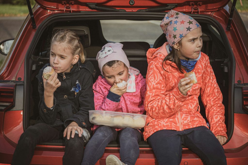 Road trip snacks are essential car trip accessories. Photo c. Ladislav Sturcell for unsplash.