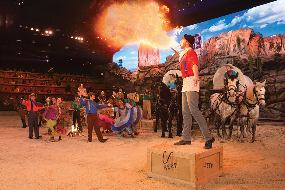 A firebreather entertains the crowd at the Dixie Stampede HoeDown show in Pigeon Forge. Photo c. Pigeon Forge Dept of Tourism.