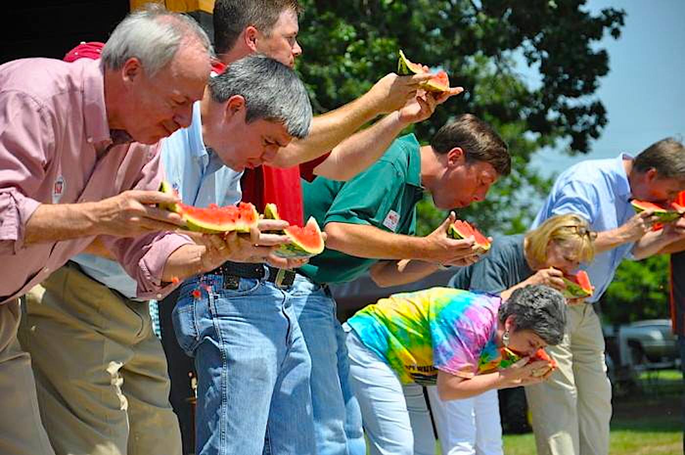 People joining in on the watermelon eating contest in Hope, Arkansas. Photo c. Hopewatermelonfest.com