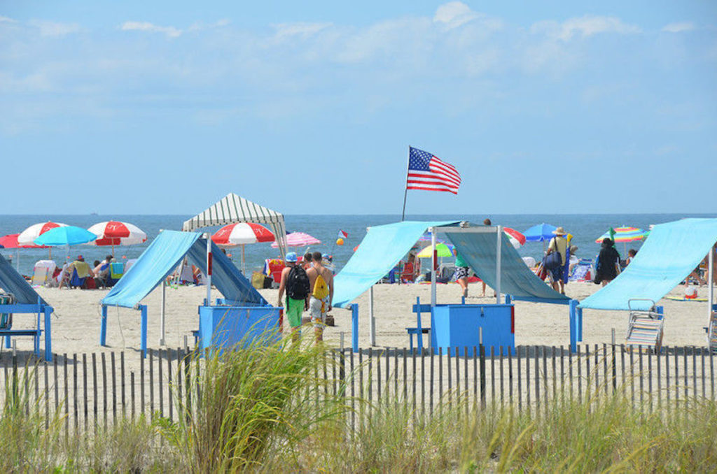 Colorful umbrellas and small shade tents at the beach of Cape May, New Jersey.