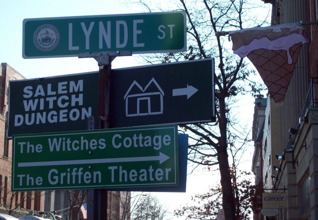 Signposts in Salem, Massachusetts call out witch-related attractions.