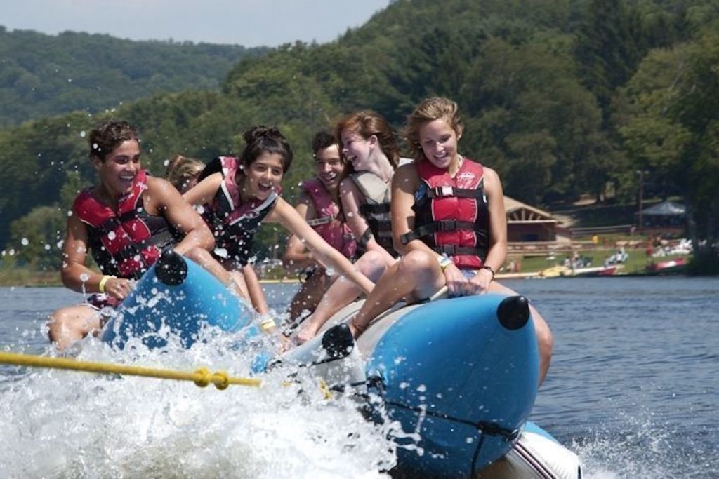 Banana boat full of kids on a lake in Connecticut.