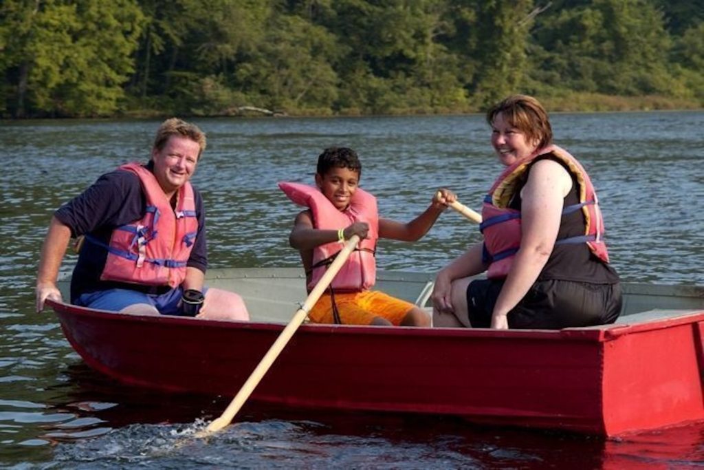 Canoeing on the beautiful freshwater lake at Camp Getaway.